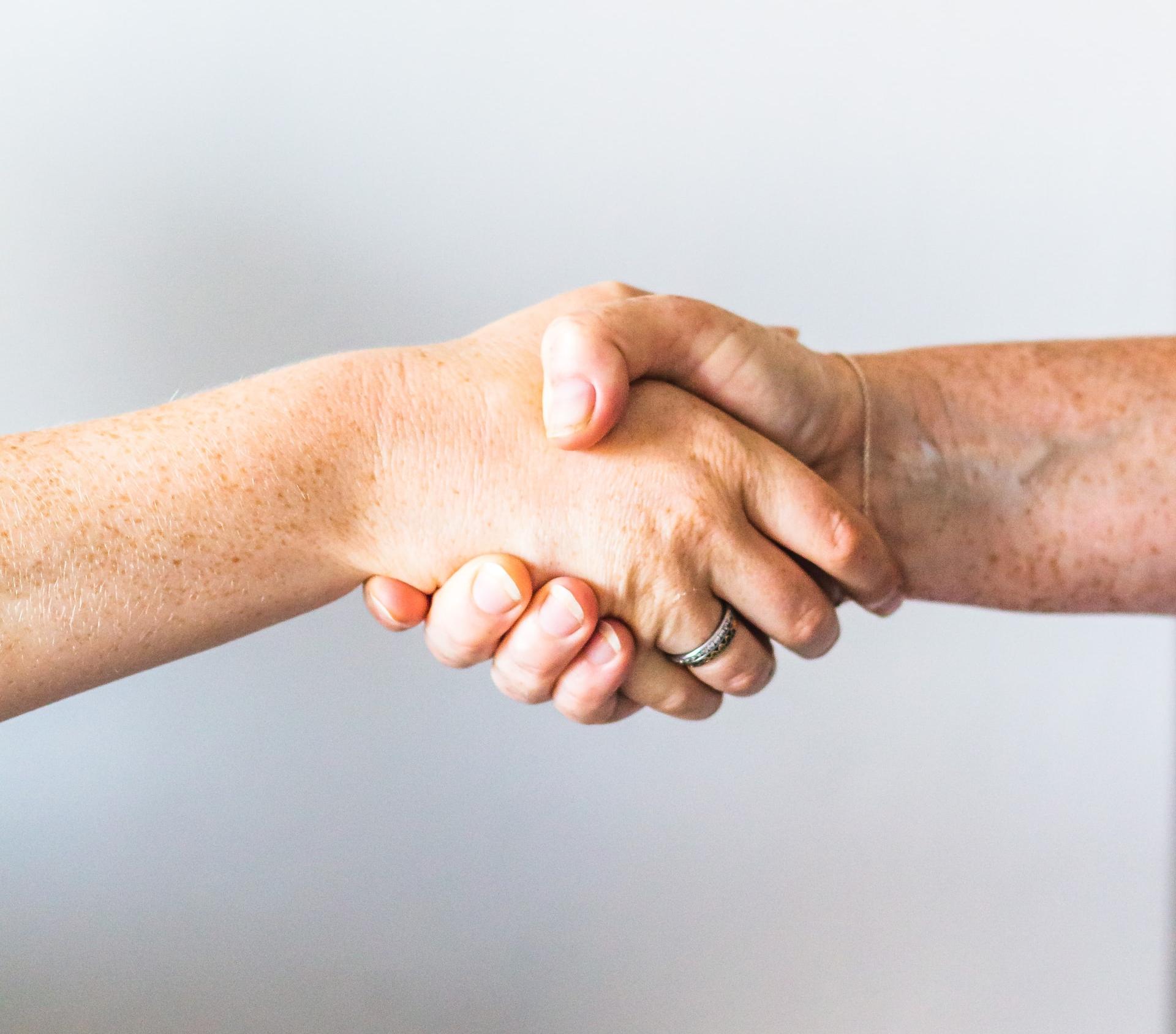 person holding hands of another person